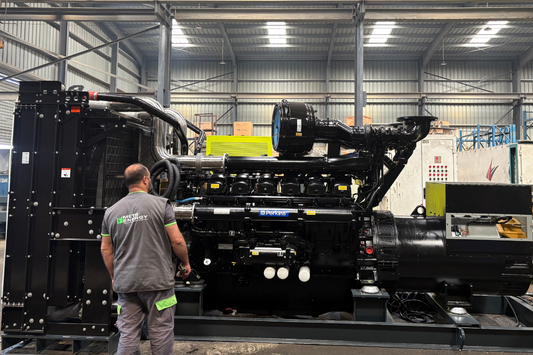 Working inspecting a 1500KVA Perkins Engine at a factory