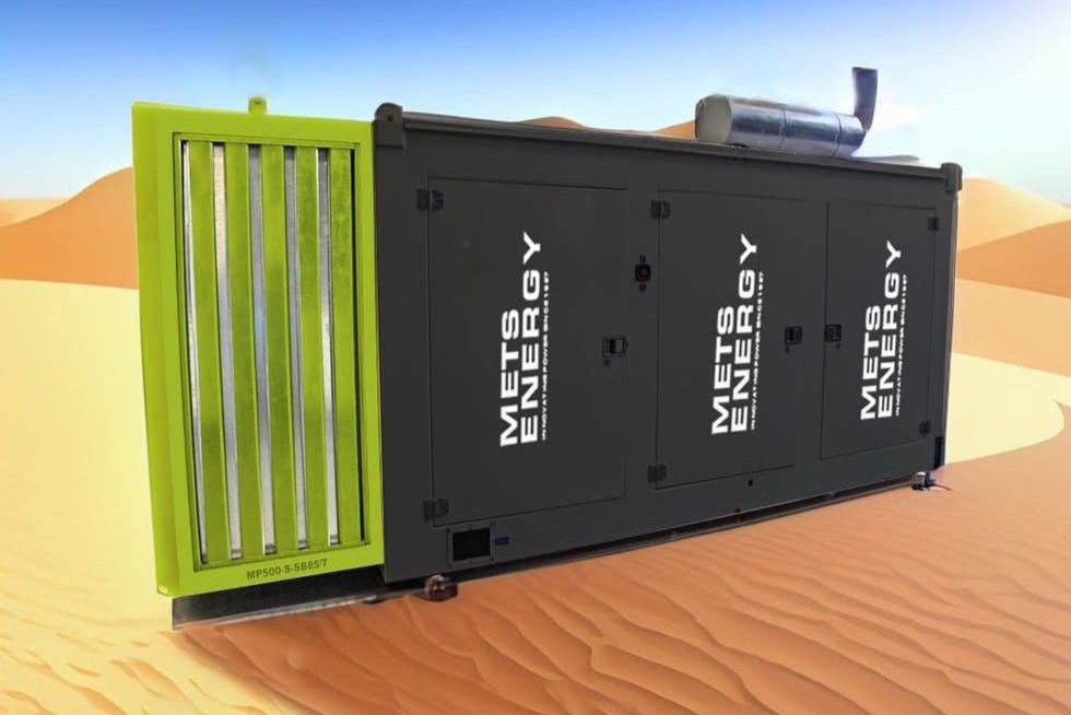 Generator canopy with METS Energy branding in a sand desert