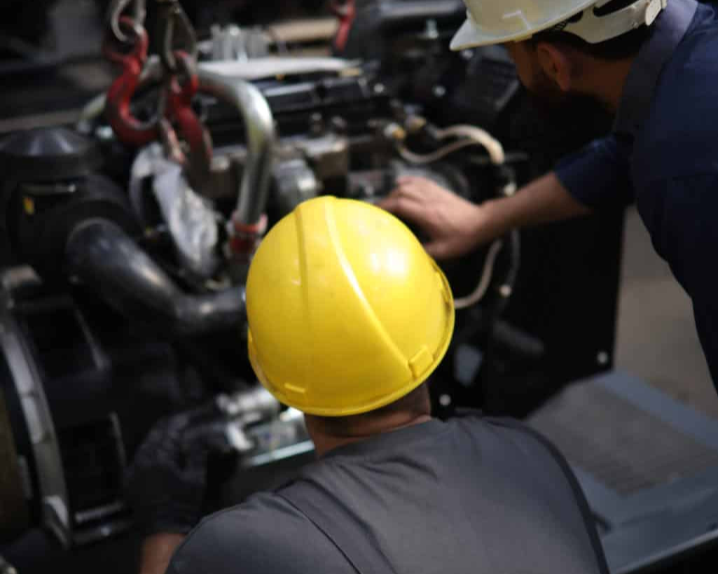 Engineers inspecting and engine